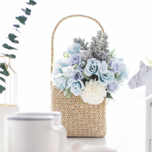 Hand holds artificial bouquet