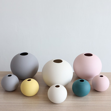 Spherical colored clay ceramic vase